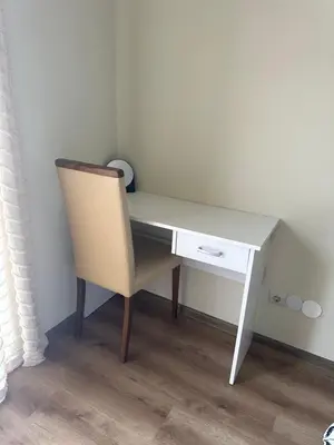 a desk with a chair and a white desk with a drawer at At Marti in Bansko