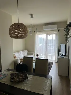 a living room with a couch and a table at At Marti in Bansko