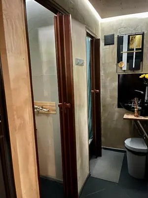 an open door to a bathroom with a toilet at Quattro Malyovitsa- Мальовица in Govedartsi