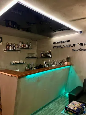 a bar with a blue counter in a room at Quattro Malyovitsa- Мальовица in Govedartsi