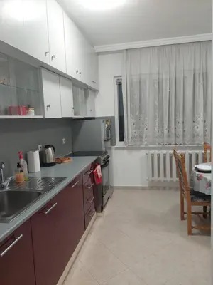 a kitchen with a sink and a counter top at апартамент У дома in Plovdiv