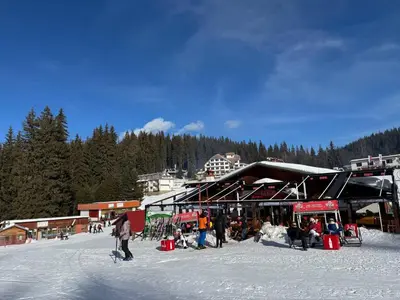 a group of people in the snow at a ski resort at Dream View Family Retreat in Pamporovo