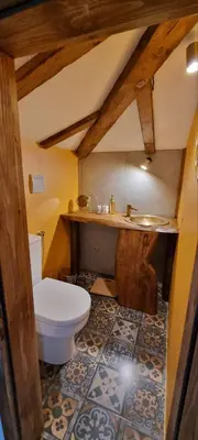 a bathroom with a toilet and a sink at Вили Панорама Лещен in Leshten