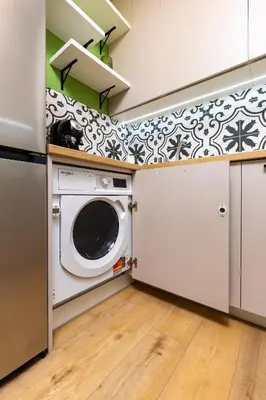 a laundry room with a washer and dryer at Bright & Cozy Studio in Plovdiv by Flat Mаnager in Plovdiv