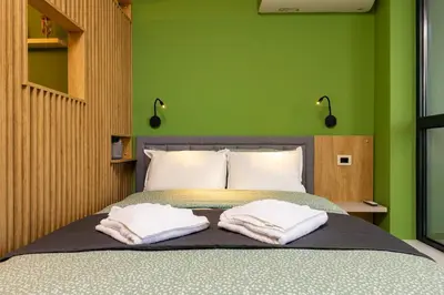 a bedroom with a bed with two towels on it at Bright & Cozy Studio in Plovdiv by Flat Mаnager in Plovdiv
