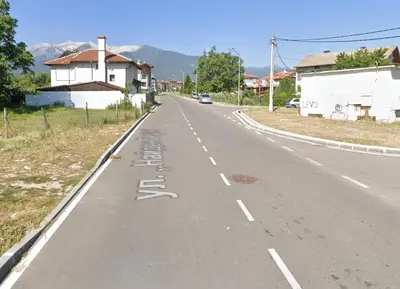 an empty road with a bike lane on it at Luxury Apartment Bansko in Bansko