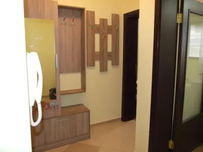 a bathroom with a sink and mirrors on the wall at Апартамент за гости 