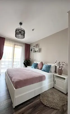a white bedroom with a large bed in a room at Elegance28 - Stylish Mountain Retreat in Bansko by Flat Mаnager in Bansko