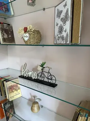 a shelf with a bike on top of it at Cozy townhouse in the heart of Sofia in Sofia