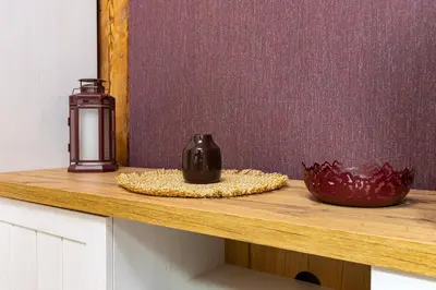 a counter with a candle and a vase on it at Kapana Art Sky Studios Parking Included in Plovdiv