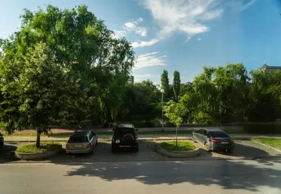 a group of three cars parked in a parking lot at Next to Kapana - Art Apartment in Plovdiv