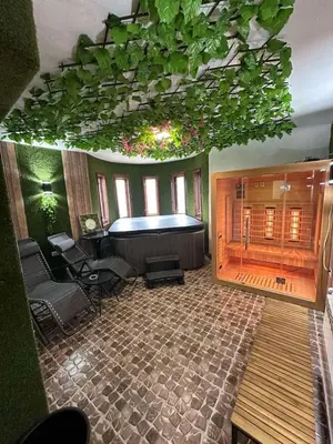 a large room with a large tub in a room with aitating at BoxRoom2 in Kyustendil