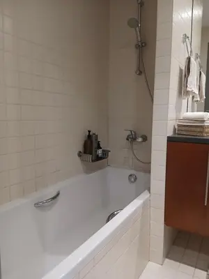 a white bathroom with a tub and a shower at Rila Mountain Design Studio, Borovets, Shiroka poliana 216 in Borovets