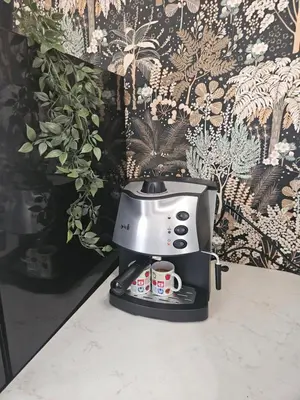 a coffee maker sitting on top of a counter at City Center Park Apartment in Sofia