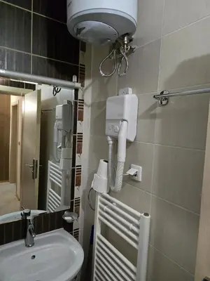 a bathroom with a sink and a toilet and a mirror at Pampo-Heaven in Smolyan