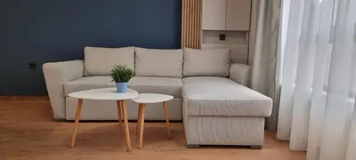 a living room with a couch and a table at MariGold Apartments in Sandanski