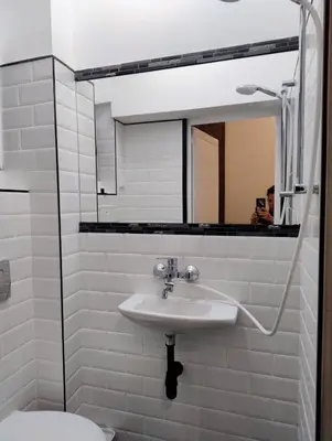 a bathroom with a sink and a mirror at Tiny studio in top center in Sofia