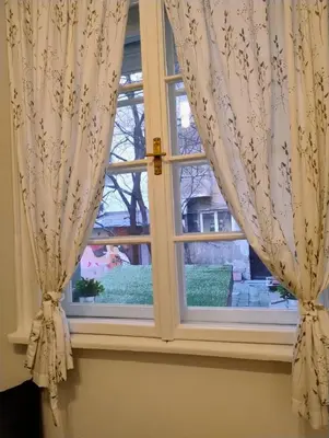 a window with curtains in a room at Tiny studio in top center in Sofia