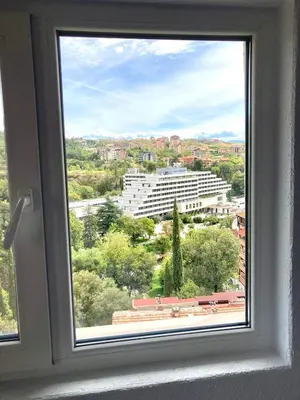a window with a view of a city at Apartment Park View in Sandanski