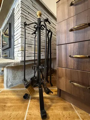 a tripod in a room next to a brick wall at Комплекс БОЖИДАРИЦА in Progled