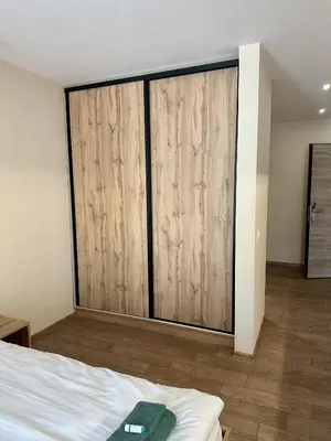a bedroom with a large sliding glass door at Music Flats in Sofia