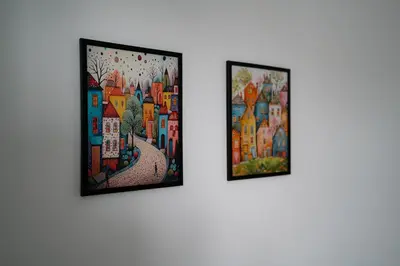 three pieces of art hanging on a wall at Top Center in Blagoevgrad