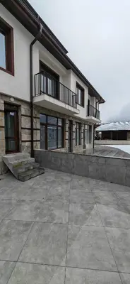 a building with two balconies on top of it at Modern apartment with terrace in Chepelare