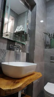 a bathroom with a white sink and a toilet at S íRMA Apartment - Next to the Old Cathedral in Sofia
