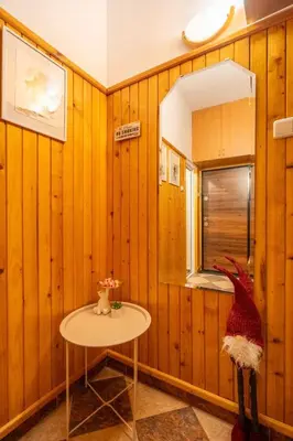a small table in a room with wooden walls at Belle Epoque-Sofia-Free parking in Sofia