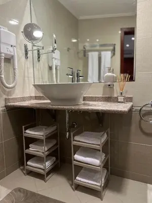 a bathroom with a sink and a mirror at Daniel's Suite - 4 Season apartment in Bansko