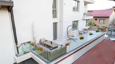 an apartment balcony with a view of a patio at Apartments Polejanov in Razlog
