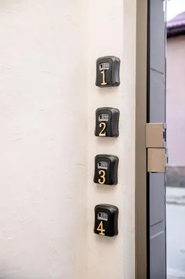 a wall with numbers on the side of a building at Apartments Polejanov in Razlog