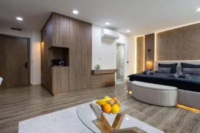 a living room with a bed and a table with fruit on it at Apartments Polejanov in Razlog