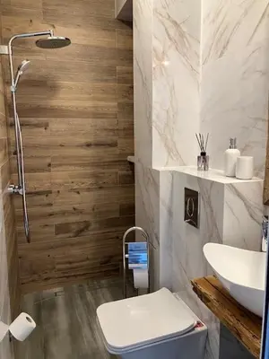 a bathroom with a sink and a toilet at Ira 28 in Sandanski