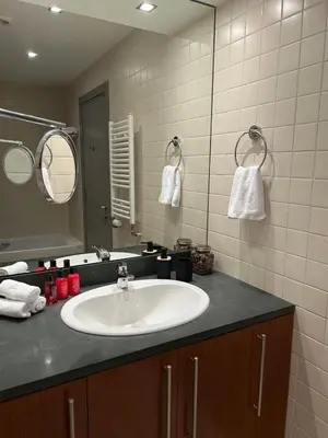 a bathroom with a sink and a mirror at Beauty&Travel Apartment Borovets in Borovets