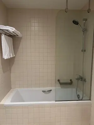 a shower in a bathroom with a tub at Beauty&Travel Apartment Borovets in Borovets