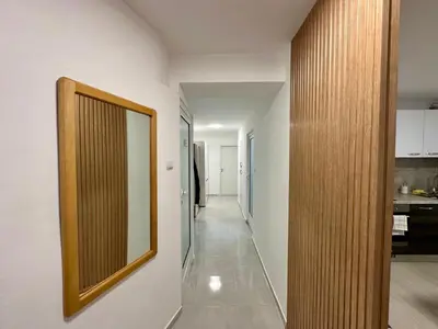 a hallway with a mirror on a wall at White Pearl Apartment - Top Location, Bright & Spacious, Newly Renovated in Sofia