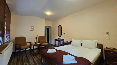 a hotel room with a bed with towels on it at Hotel Izvorat Arda - Хотел Изворът Арда in Arda