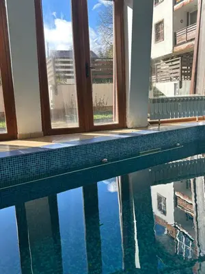 a swimming pool with a view of the water at Ski-in Flat Next to Ski Road at Mountain View in Bansko