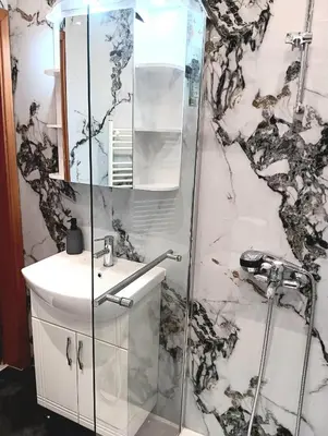 a bathroom with a shower and a sink at Double to bul Tsar Boris 3 in Sofia