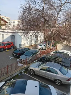 a group of cars parked in a parking lot at Double to bul Tsar Boris 3 in Sofia