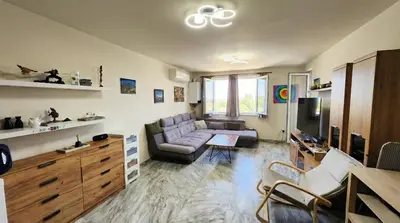 a living room with a couch and a tv at Zen Lodge, with private parking next to Paradise in Sofia
