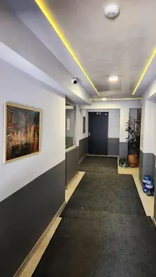 a room with a hallway with a painting on the wall at Zen Lodge, with private parking next to Paradise in Sofia