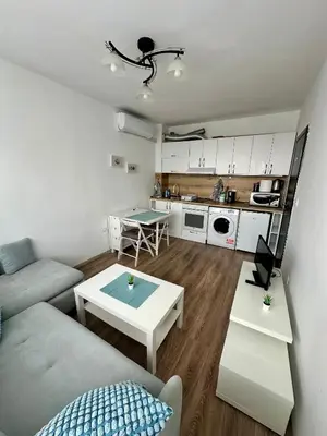 a living room with a couch and a table at Maria Luiza 1 Bedroom Apartment in Sofia