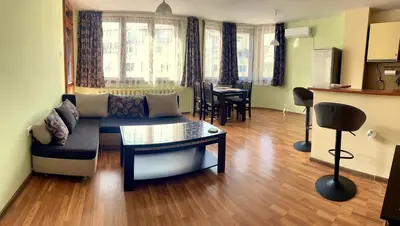 a living room with a couch and a table at Charming Urban Retreat in Sofia in Sofia