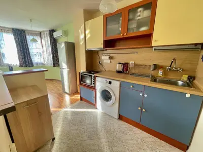 a kitchen with a sink and a washing machine at Charming Urban Retreat in Sofia in Sofia
