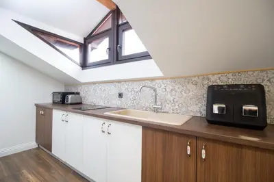 a kitchen with a sink and a skylight at Lambrina 2 Apartment in Plovdiv