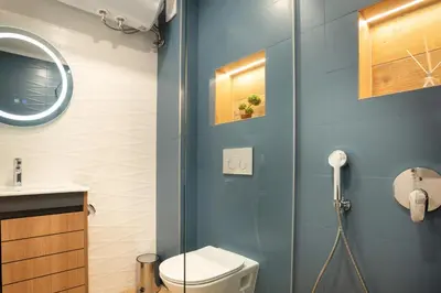 a bathroom with a toilet and a glass shower at Studio Sapphire in Sofia