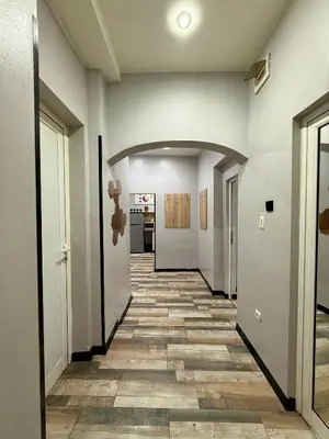an empty hallway with a tile floor at The Rainbow 10 in Sofia
