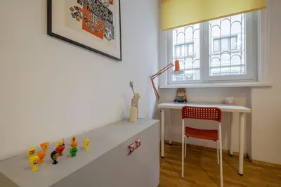 a room with a desk and a red chair at THE GOOD PLACE - historical center, unique in Sofia